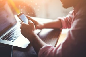 A man searching for businesses that have local SEO strategies